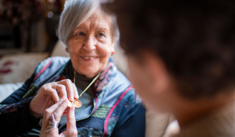 grandmother showing granddaughter golden locket ne 2025 10 19 05 33 48 utc