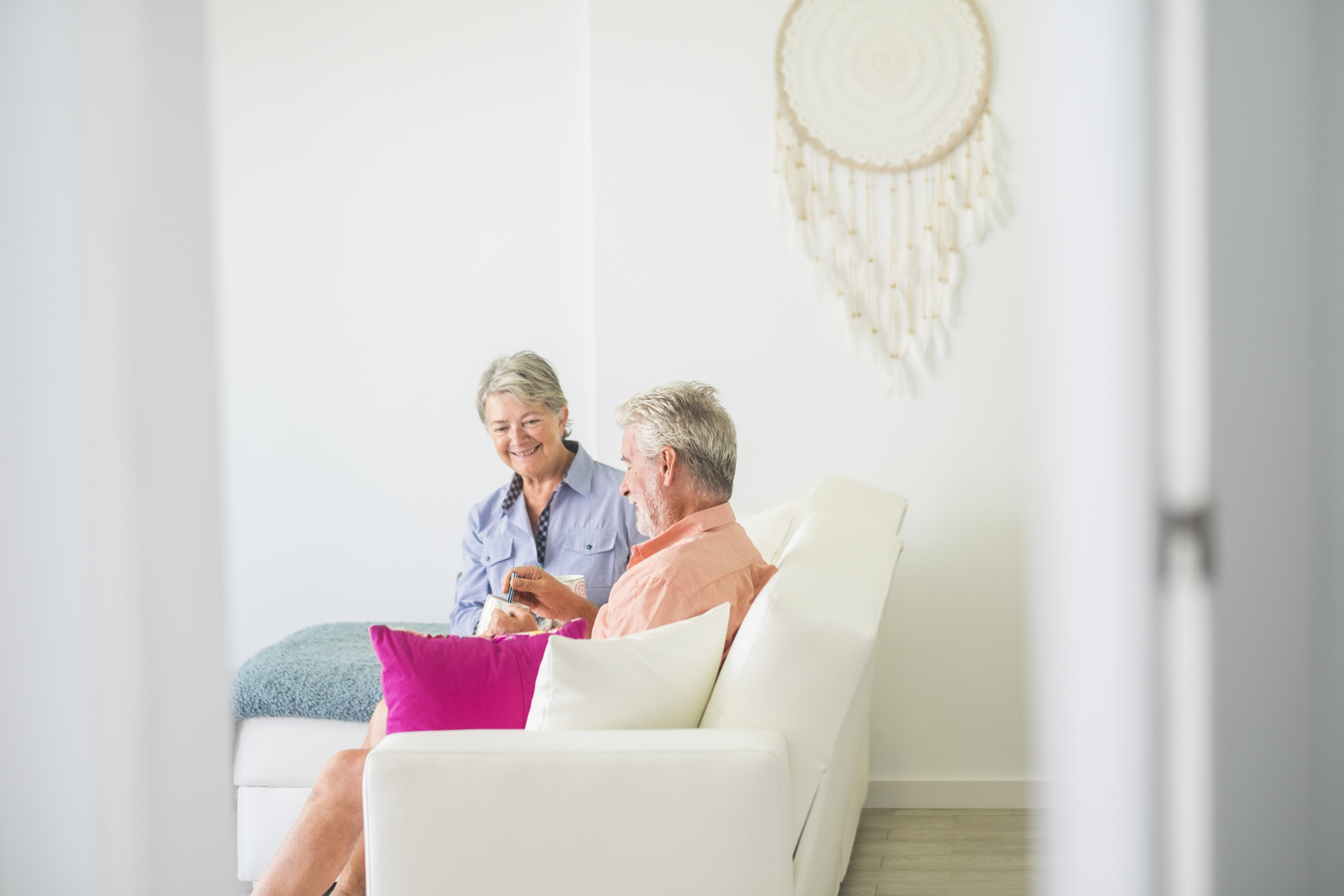 Happy Senior Retired Couple At Home Sitting On The 2026 01 08 22 10 22 Utc