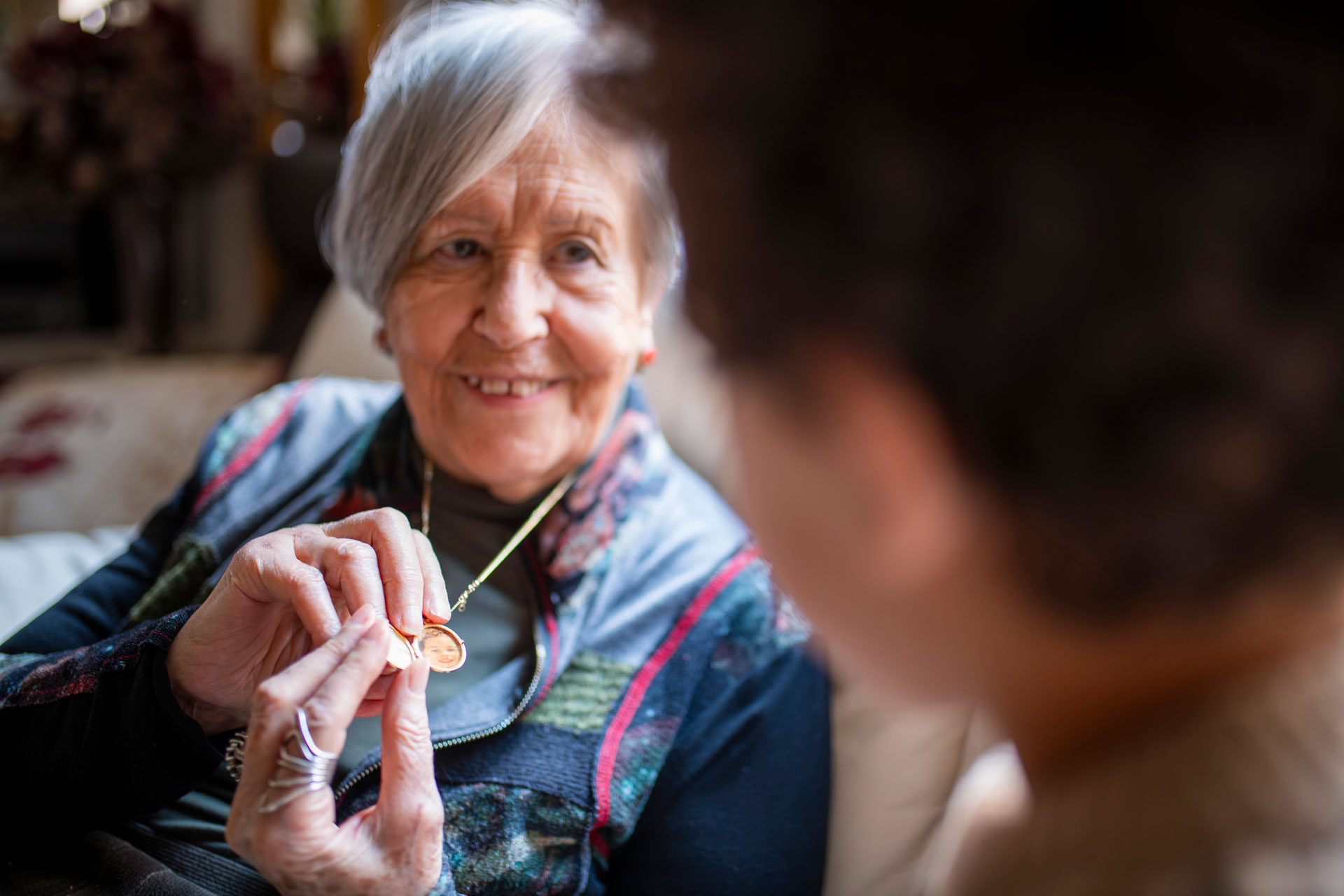 grandmother showing granddaughter golden locket ne 2025 10 19 05 33 48 utc