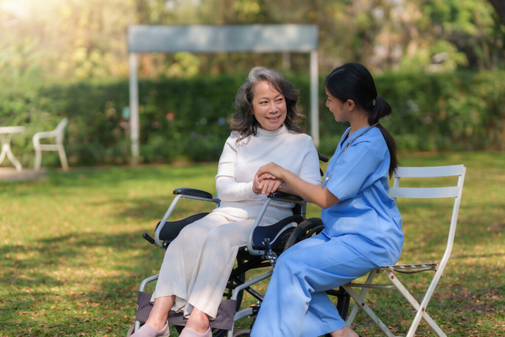 Woman In Wheelchair Holds Hands With Young Woman 2026 03 19 10 40 05 Utc